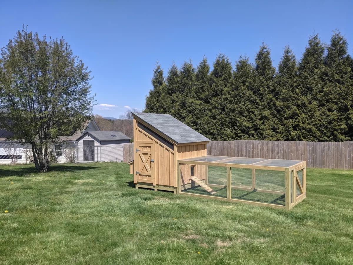 Lean-to coop with front run in a backyard (representative image)